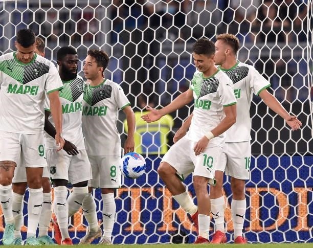 Filip Djuricic of US Sassuolo celebrates with his teammates after scoring goal 1-1 during the Serie A match between AS Roma and US Sassuolo at Stadio...