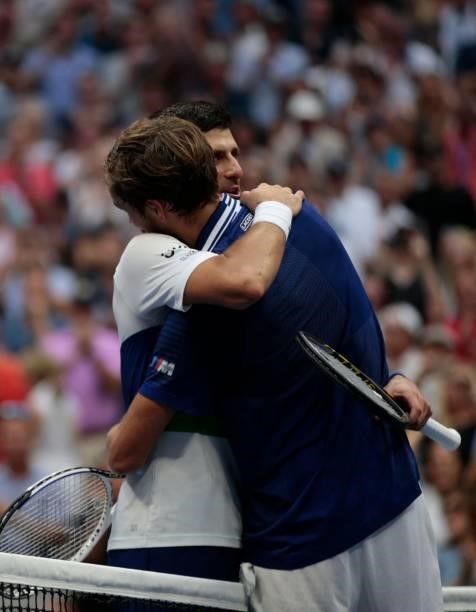Russia's Daniil Medvedev greets Serbia's Novak Djokovic at the net after winning during their 2021 US Open Tennis tournament men's final match at the...