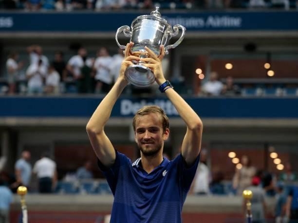 Russia's Daniil Medvedev celebrates with the trophy after winning the 2021 US Open Tennis tournament men's final match against Serbia's Novak...