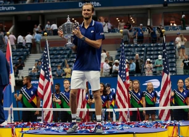 Russia's Daniil Medvedev celebrates with the trophy after winning the 2021 US Open Tennis tournament men's final match against Serbia's Novak...