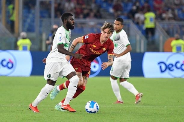 Jeremie Boga of US Sassuolo Calcio and Nicolo' Zaniolo of AS Roma in action during the Italian Football Championship League A 2021/2022 match between...