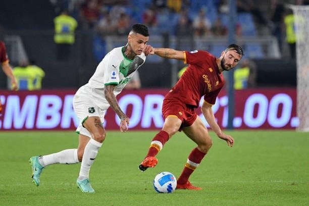 Gianluca Scamacca of US Sassuolo Calcio and Bryan Cristante of AS Roma in action during the Italian Football Championship League A 2021/2022 match...