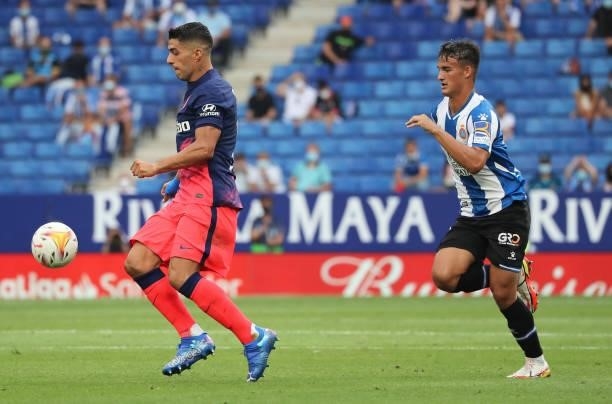 Luis Suarez and Lluis Recasens during the match between FC RCD Espanyol and Atletico de Madrid, corresponding to the week 4 of the Liga Santander,...