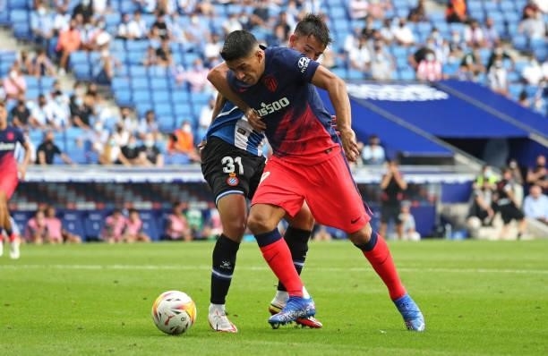 Luis Suarez and Lluis Recasens during the match between FC RCD Espanyol and Atletico de Madrid, corresponding to the week 4 of the Liga Santander,...