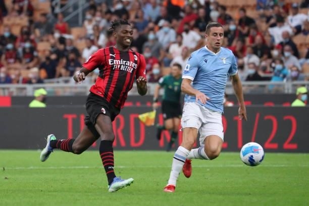 Adam Marusic of SS Lazio competes for the ball with Rafael Leao of AC Milan during the Serie A match between AC Milan and SS Lazio at Stadio Giuseppe...