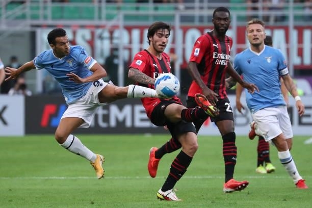 Pedro of SS Lazio competes for the ball with Sandro Tonali of AC Milan during the Serie A match between AC Milan and SS Lazio at Stadio Giuseppe...