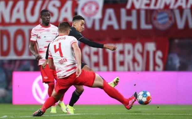 Bayern Munich's German midfielder Jamal Musiala scores his team's second goal past Leipzig's Hungarian defender Willi Orban during the German first...