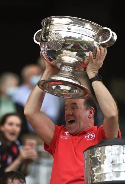 Dublin , Ireland - 11 September 2021; Tyrone joint-manager Feargal Logan lifts the Sam Maguire Cup after the GAA Football All-Ireland Senior...