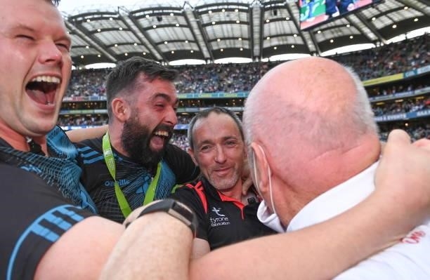 Dublin , Ireland - 11 September 2021; Tyrone joint-manager Brian Dooher, centre, celebrates with Tyrone strength and conditioning coach Peter...