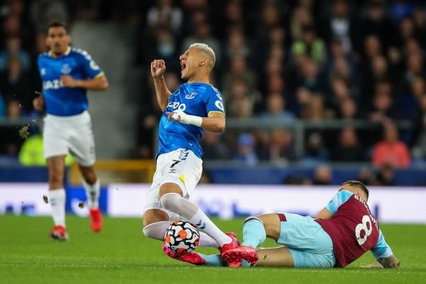 Richarlison of Everton is tackled by Josh Brownhill of Burnley during the Premier League match between Everton and Burnley at Goodison Park on...