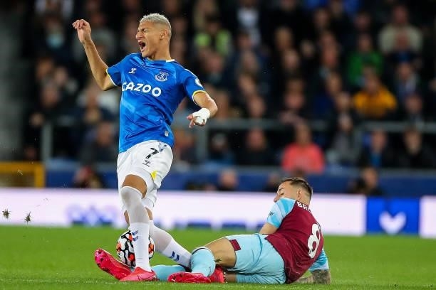 Richarlison of Everton is tackled by Josh Brownhill of Burnley during the Premier League match between Everton and Burnley at Goodison Park on...