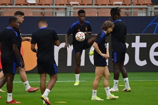 Real Madrid's Brazilian forward Vinicius Junior and teammates take part in a training session at the San Siro stadium, in Milan, on September 14 on...