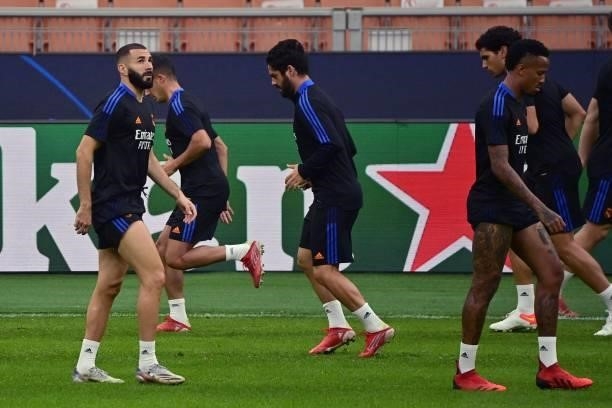 Real Madrid's French forward Karim Benzema and teammates take part in a training session at the San Siro stadium, in Milan, on September 14 on the...