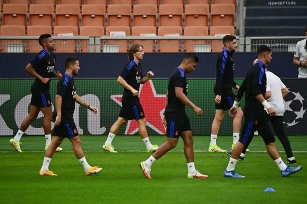 Real Madrid's Croatian midfielder Luka Modric and teammates participate in a training session at the San Siro stadium, in Milan, on September 14 on...