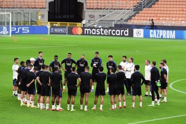Real Madrid players listen to Real Madrid's Italian coach Carlo Ancelotti a training session at the San Siro stadium, in Milan, on September 14 on...