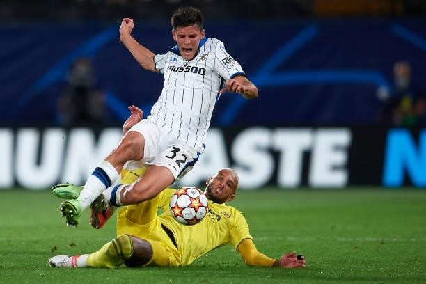 Matteo Pessina of Atalanta and Etienne Capoue of Villarreal compete for the ball during the UEFA Champions League group F match between Villarreal CF...