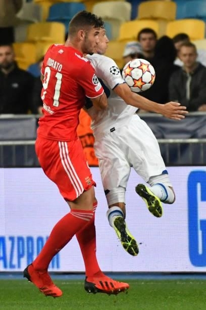 Benfica's Brazilian defender Morato and Dynamo Kiev's Ukrainian midfielder Denys Garmash vie for the ball during the UEFA Champions League football...