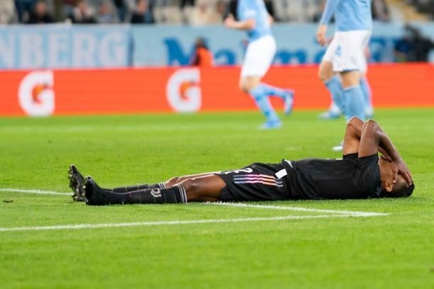Alex Sandro of Juventus FC lies on the lawn during the UEFA Champions League group H match between Malmo FF and Juventus at Malmo New Stadium on...