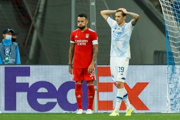 Nicolas Otamendi of SL Benefica and Denys Garmash of Dinamo Kiev look dejected during the UEFA Champions League Group E match between Dinamo Kiev and...