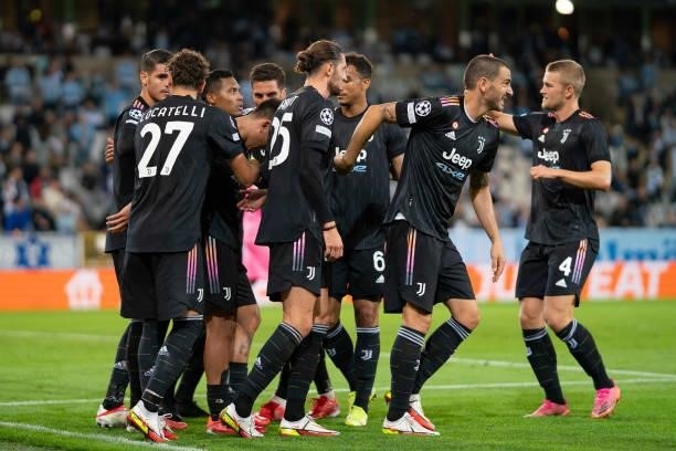 Paulo Dybala of Juventus FC celebrates after scoring his team's second goal with teammates during the UEFA Champions League group H match between...