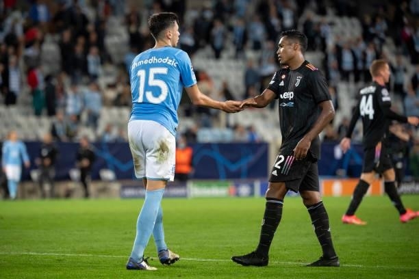 Anel Ahmedhodzic of Malmo FF and Alex Sandro of Juventus during the UEFA Champions League group H match between Malmo FF and Juventus at Eleda...