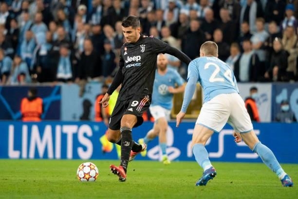 Alvaro Morata of Juventus FC and Lasse Nielsen of Malmo FF battle for the ball during the UEFA Champions League group H match between Malmo FF and...