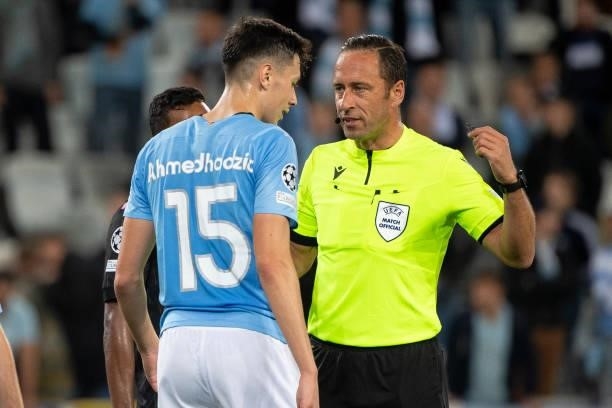 Artur Dias, referee and Anel Ahmedhodzic of Malmo FF talk during the UEFA Champions League group H match between Malmo FF and Juventus at Eleda...