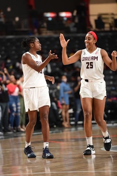 Tiffany Hayes of the Atlanta Dream high-fives teammate Monique Billings during the game against the Indiana Fever on September 14, 2021 at Gateway...