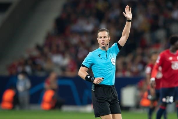 Referee Danny Makkelie gestures during the UEFA Champions League group G match between Lille OSC and VfL Wolfsburg at Stade Pierre-Mauroy on...