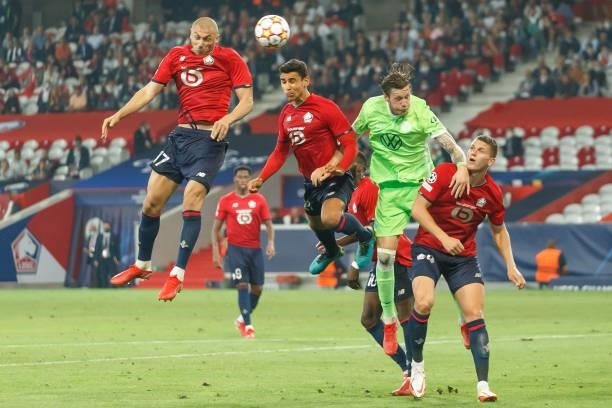 Burak Yilmaz of Lille OSC, Benjamin Andre of Lille OSC, Wout Weghorst of VfL Wolfsburg and Sven Botman of Lille OSC battle for the ball during the...
