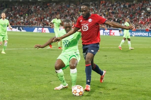 Jerome Roussillon of VfL Wolfsburg and Jonathan Ikone of Lille OSC battle for the ball during the UEFA Champions League group G match between Lille...