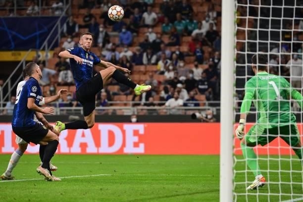 Inter Milan's Croatian midfielder Ivan Perisic goes for the ball during the UEFA Champions League Group D football match between Inter Milan and Real...