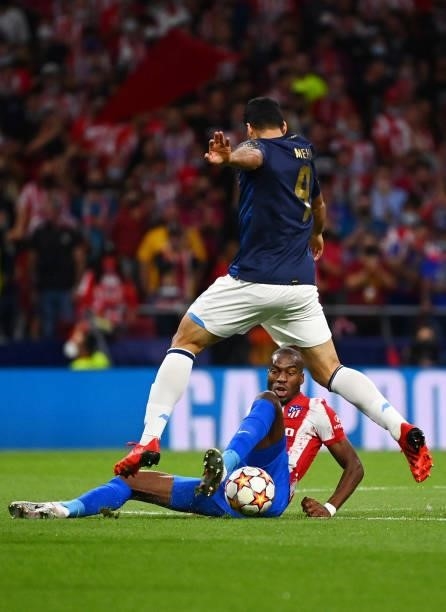 Porto's Portuguese defender Diogo Leite vies with Atletico Madrid's French midfielder Geoffrey Kondogbia during the UEFA Champions League first round...