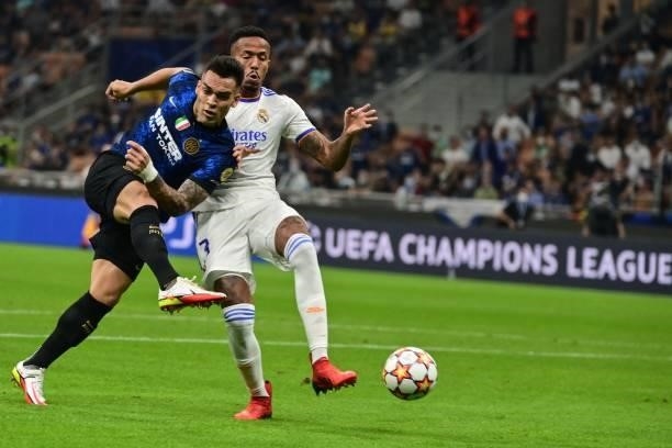 Inter Milan's Argentine forward Lautaro Martinez challenges Real Madrid's Brazilian defender Eder Militao during the UEFA Champions League Group D...