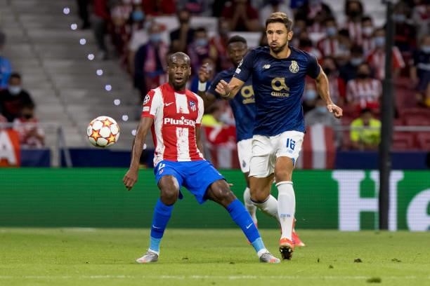 Geoffrey Kondogbia of Atletico de Madrid and Marko Grujic of FC Porto battle for the ball during the UEFA Champions League group B match between...