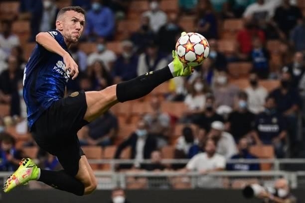 Inter Milan's Croatian midfielder Ivan Perisic goes for the ball during the UEFA Champions League Group D football match between Inter Milan and Real...