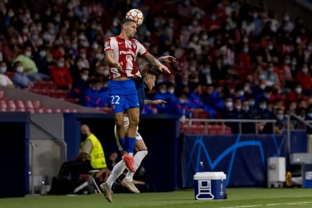Otavio of FC Porto and Mario Hermoso of Atletico de Madrid battle for the ball during the UEFA Champions League group B match between Atletico Madrid...