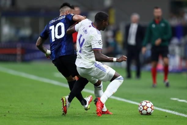 Lautaro Martinez of FC Internazionale and David Alaba of Real Madrid CF battle for the ball during the UEFA Champions League group D match between...