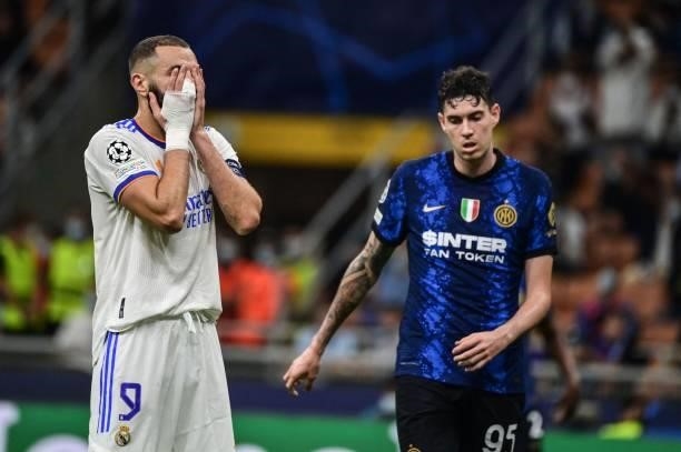 Real Madrid's French forward Karim Benzema reacts next to Inter Milan's Italian defender Alessandro Bastoni during the UEFA Champions League Group D...