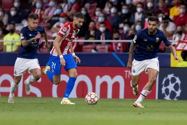 Otavio of FC Porto and Yannick Carrasco of Atletico de Madrid battle for the ball during the UEFA Champions League group B match between Atletico...