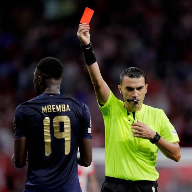 Chancel Mbemba of FC Porto receives a red card during the UEFA Champions League match between Atletico Madrid v FC Porto at the Estadio Wanda...