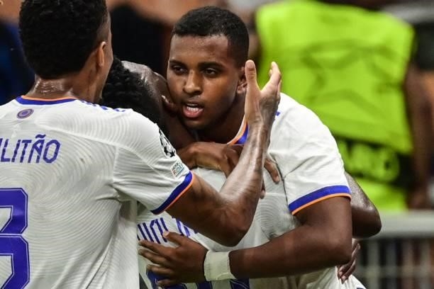 Real Madrid's Brazilian forward Rodrygo celebrates with Real Madrid's Brazilian forward Vinicius Junior after opening the scoring during the UEFA...