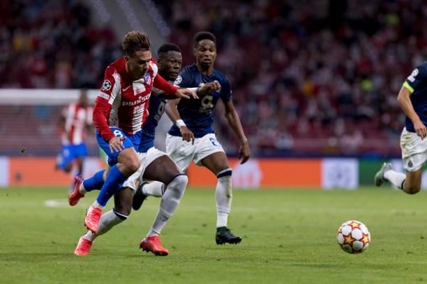 Antoine Griezmann of Atletico de Madrid and Chancel Mbemba of FC Porto battle for the ball during the UEFA Champions League group B match between...