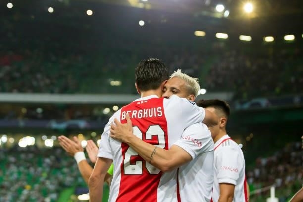 Sebastian Haller of Ajax Amsterdam celebrates after scoring his team's fifth goal with teammates during the UEFA Champions League group C match...