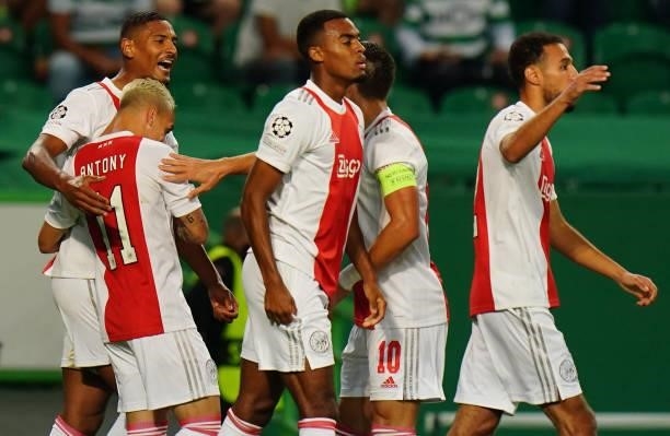 Sebastien Haller of AFC Ajax celebrates with teammates after scoring a goal during the Group C - UEFA Champions League match between Sporting CP and...