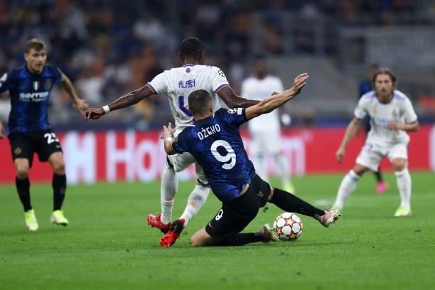 Edin Dzeko of FC Internazionale and David Alaba of Real Madrid CF battle for the ball during the UEFA Champions League group D match between Inter...