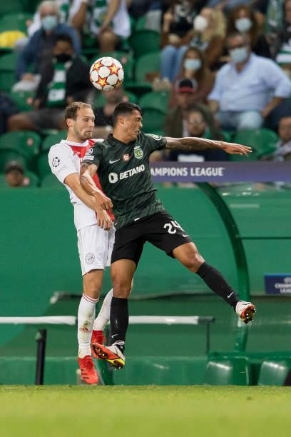 Daley Blind of Ajax Amsterdam and Pedro Porro of Sporting CP battle for the ball during the UEFA Champions League group C match between Sporting CP...