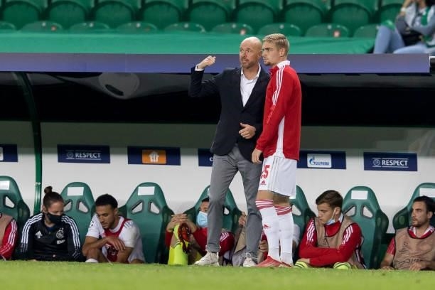 Head coach Erik ten Hag of Ajax Amsterdam speaks with Kenneth Taylor of Ajax Amsterdam during the UEFA Champions League group C match between...