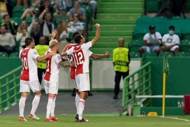 Sebastian Haller of Ajax Amsterdam celebrates after scoring his team's fourth goal with teammates during the UEFA Champions League group C match...