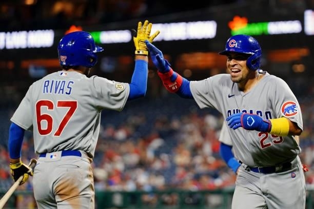 Robinson Chirinos of the Chicago Cubs celebrates with Alfonso Rivas after hitting a two run home run in the top of the eighth during the game between...